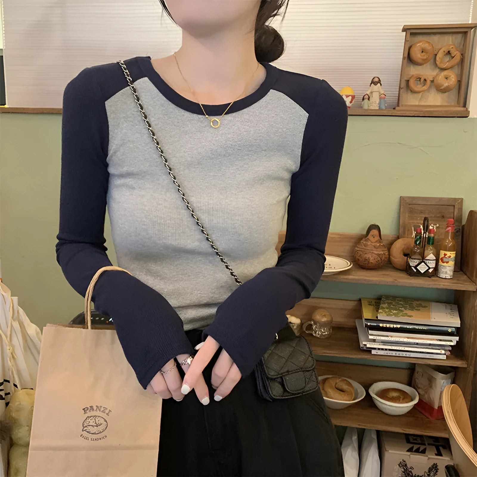 Women's oversized long sleeve top in dark blue black or green with princess sleeves and embroidery details