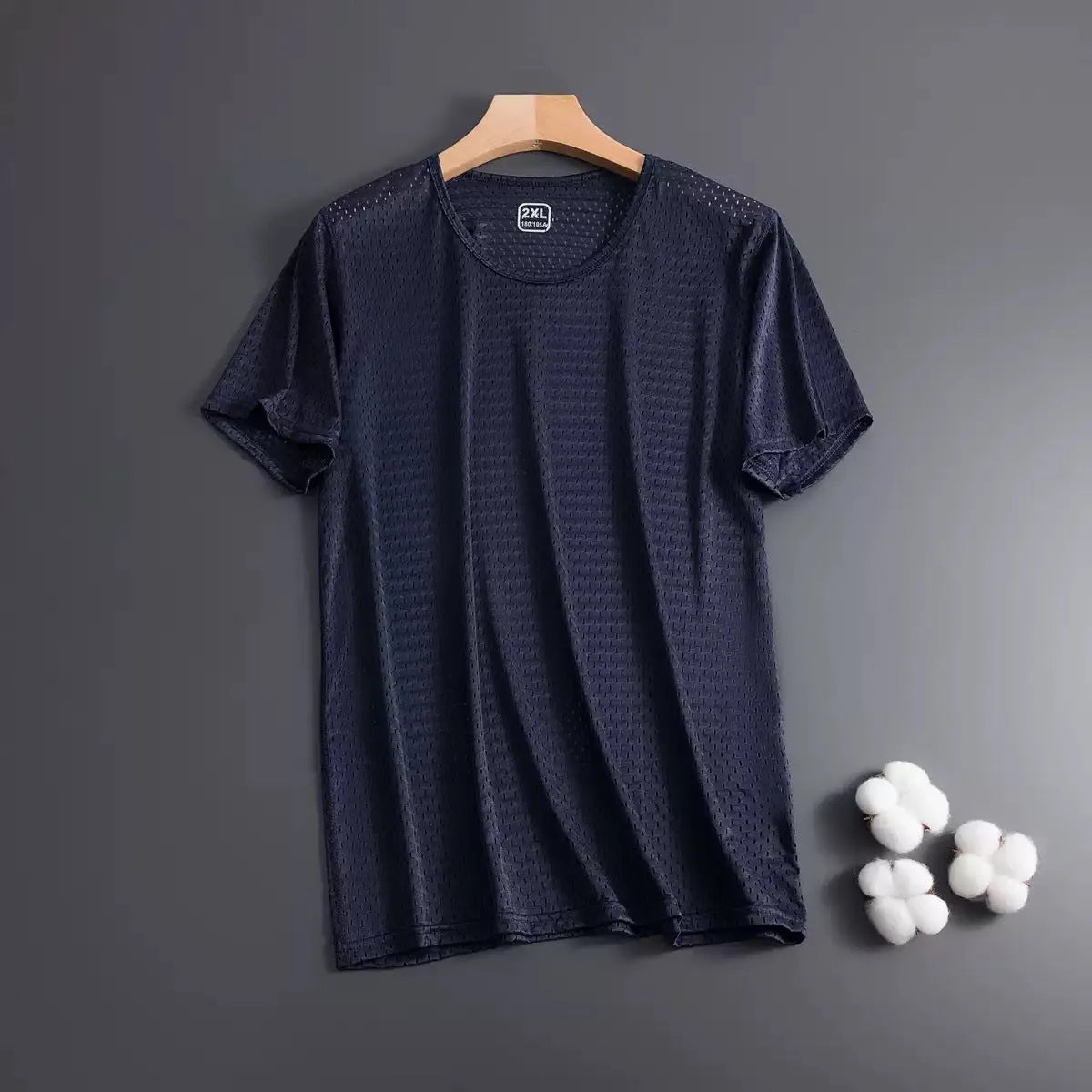 Men's solid colour Ice Silk short sleeve crew neck T-shirt in loose fit on a hanger.