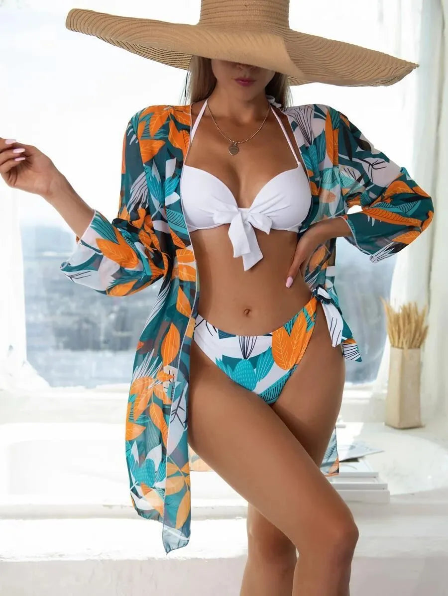 Women's three-piece bikini swimsuit set with mesh split detail and a cover-up coat.