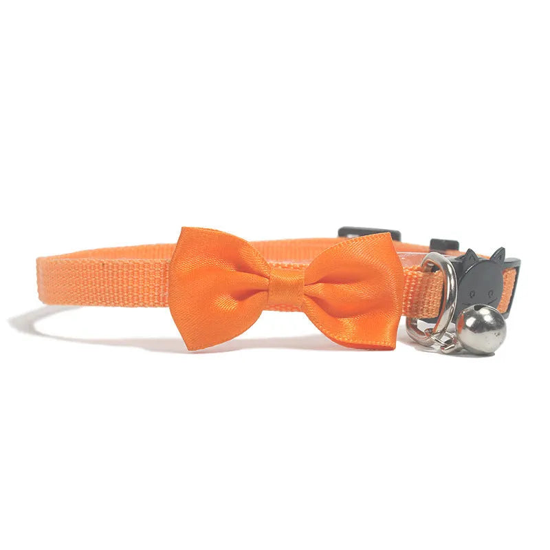 Adjustable striped nylon cat collar with a small bell, shown in multiple colour options on a white background.