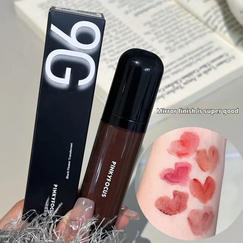 Black shiny makeup mirror lip lacquer tube showing one of six Black Citrus colour options