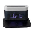 Modern black and white wireless charging desk clock with integrated night light and table lamp.