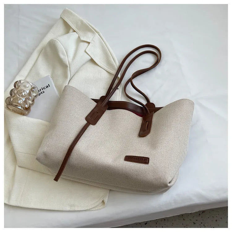 Shoulder bag in Oxford cloth with double straps, available in Black and Brown, size 46x32x27cm