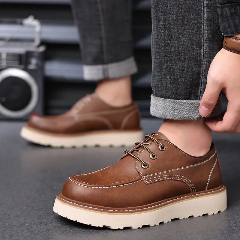 Men's black low-top casual boots with round toe and rubber sole