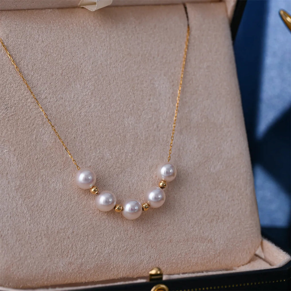 Sky Star 18K gold pearl necklace with round sea pearl 7.5-8mm and adjustable 45cm chain on white background