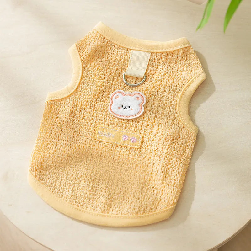 Colourful knitted cat clothes with a bear patch, showing hollowed-out breathable fabric.