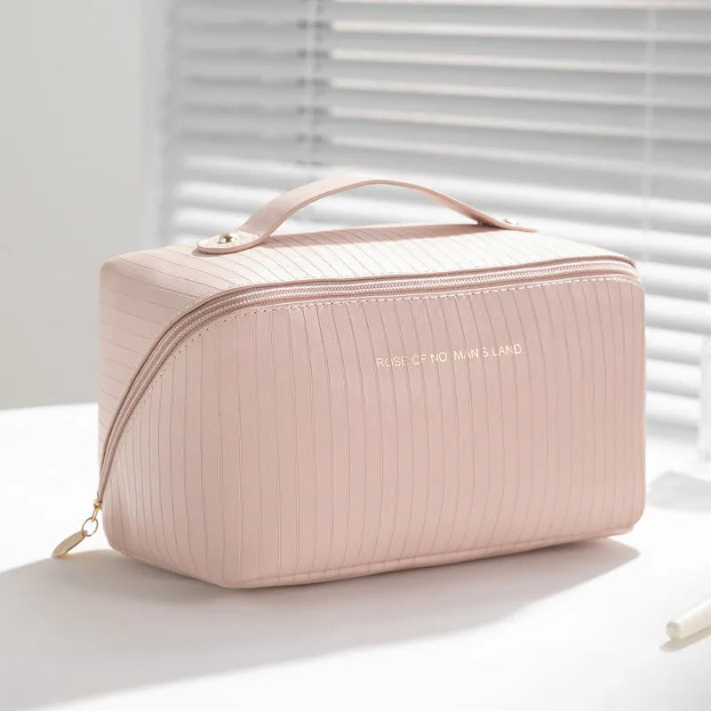 Beige cubic PU vertical pattern pillow makeup bag for travel, showing dimensions of 22.5cm by 12.5cm.