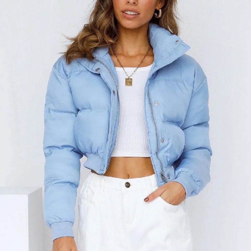 Women's loose blue polyester casual jacket with long sleeves on a hanger.