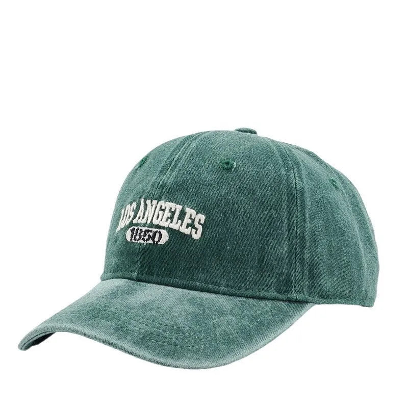 Retro-style personalised baseball cap with distressed letter embroidery on an adjustable strap, shown in beige colour.