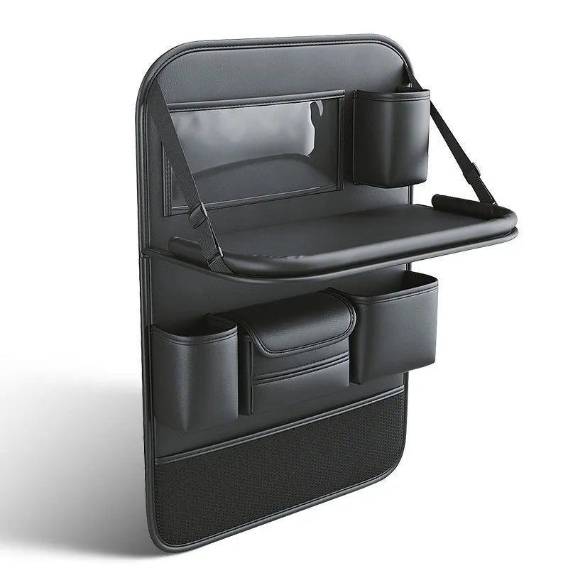 Car seat lazyback storage bag in Obsidian Black with foldable dining table extended, hanging on a car front seat backrest