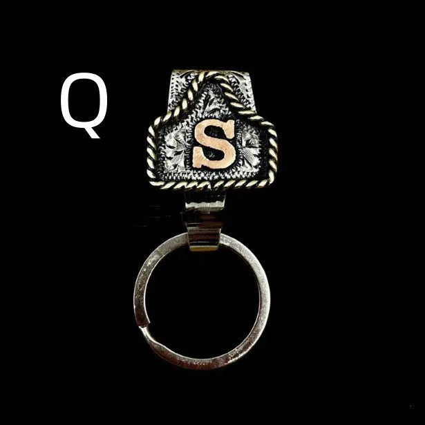 Handmade metal keychain with a cow tag charm in one of 26 available colour options.