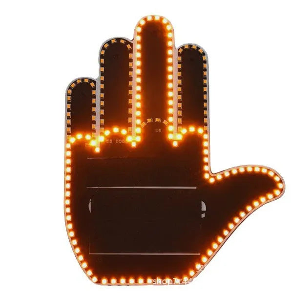 Black plastic car gesture light with LED illuminated hand gesture, remote control, and 3M Velcro mounting
