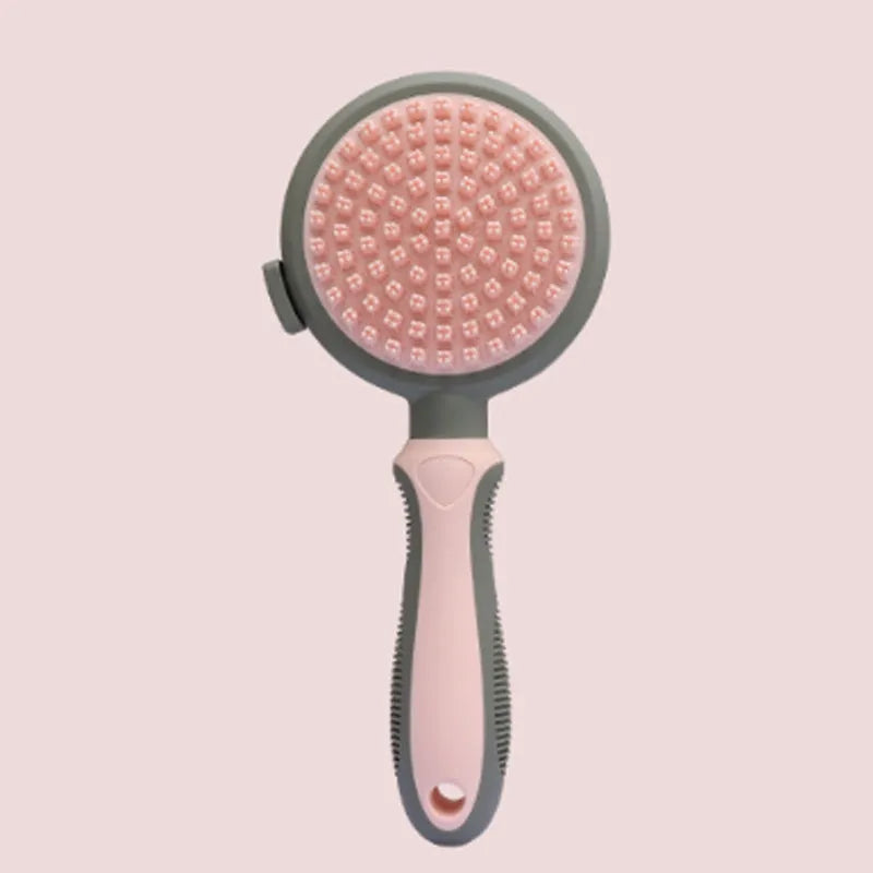 Two-sided silicone cat brush with green handle, showing slicker brush and massage sides