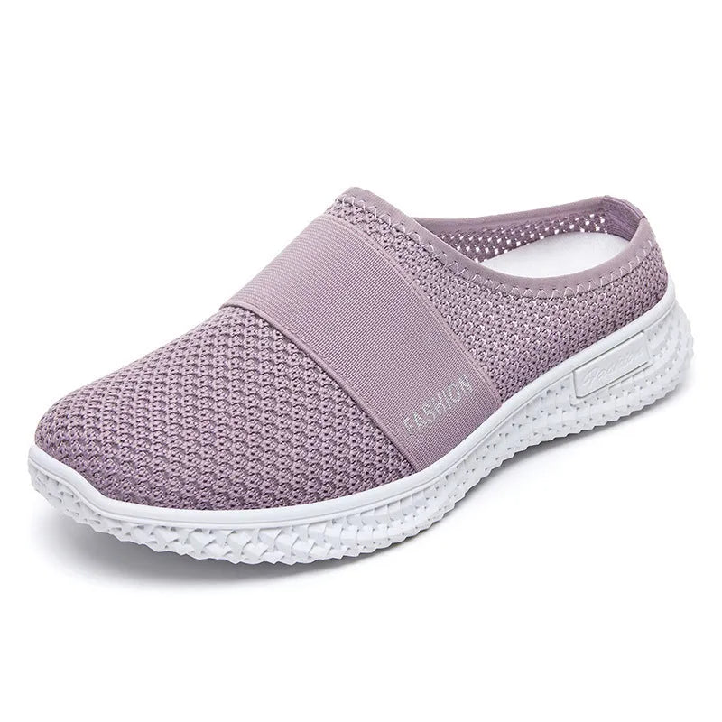 Women's black mesh casual flat shoe with round toe and hollow-out design on a neutral background.