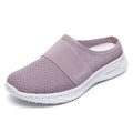 Women's black mesh casual flat shoe with round toe and hollow-out design on a neutral background.