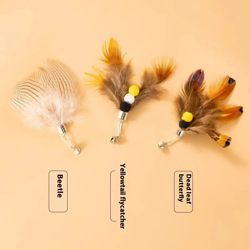 Three steel wire cat toy replacement heads with colourful small flying insect designs on scratch-resistant bases