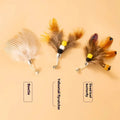 Three steel wire cat toy replacement heads with colourful small flying insect designs on scratch-resistant bases