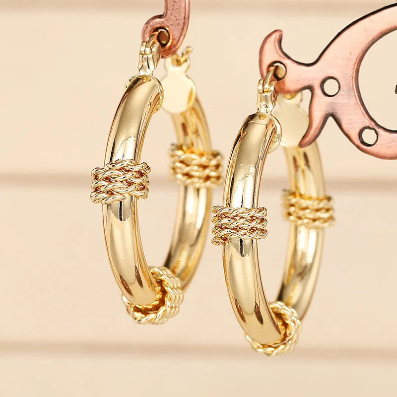 Geometric copper earrings for women in golden colour with ring and line design elements