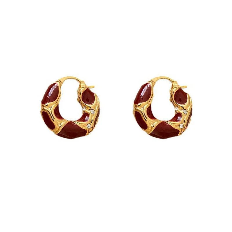 Gold plated alloy small hoop earrings with enamel colour in red, black, and white geometric shapes