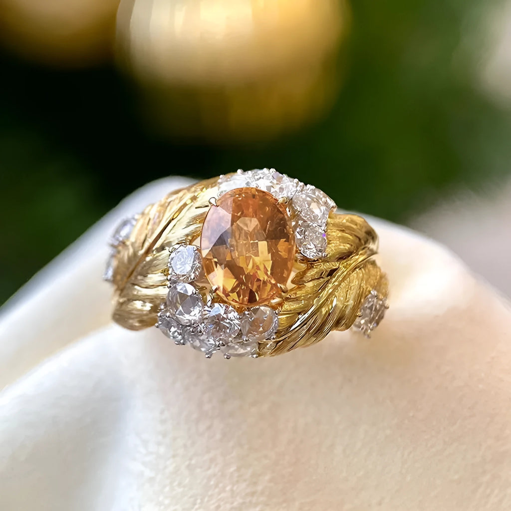 Gold colour copper women's ring with embossed feather pattern and yellow zircon stones on geometric band