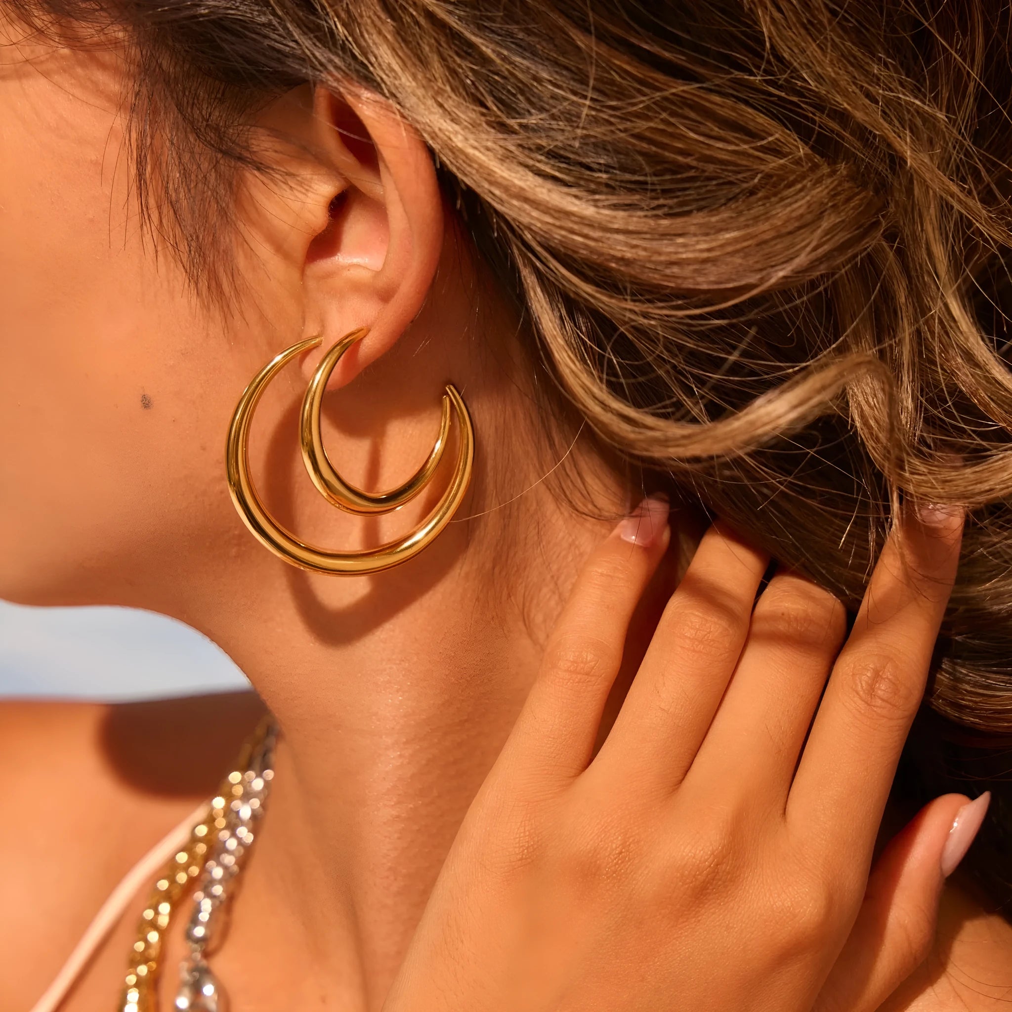 Geometric round titanium steel hoop earrings in gold and stainless steel finishes, small and large sizes