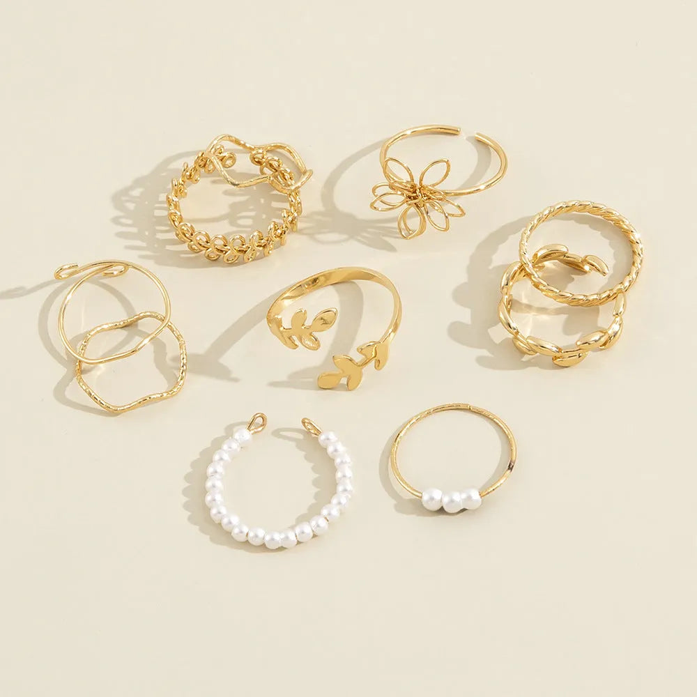Openwork flower set ring with glossy gold finish showing floral pattern detail