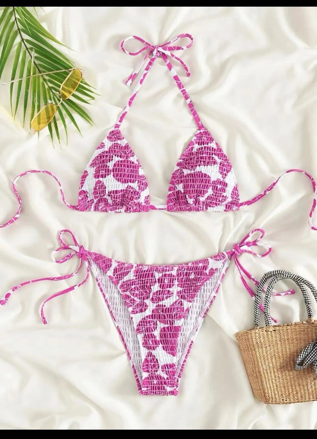 Women's floral patterned halter-neck bikini set in multiple colours on a mannequin
