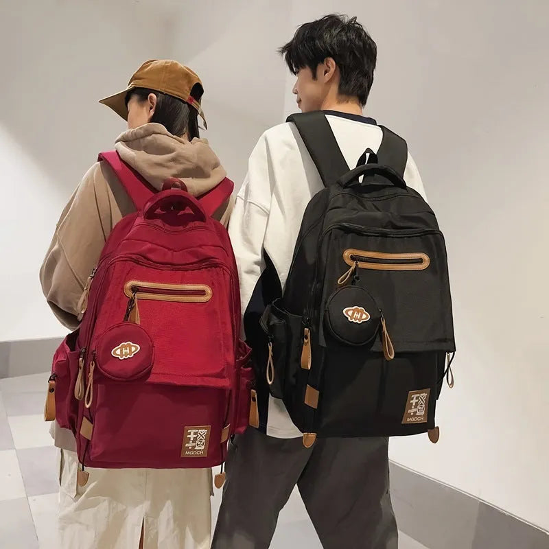 Large capacity nylon backpack for middle school students with curved shoulder straps in multiple colour options