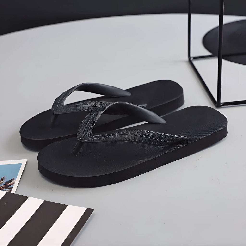 Fish brand rubber flip-flops in green, showing non-slip sole and thong design.