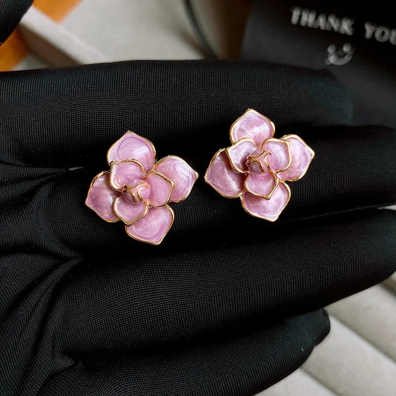Gold plated purple flower stud earrings with oil-spot glaze finish and fresh style