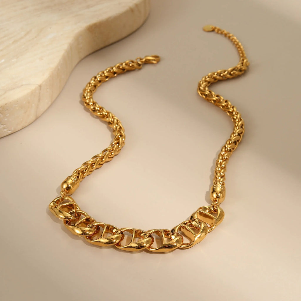 Gold electroplated stainless steel necklace with geometric pendant on regular chain