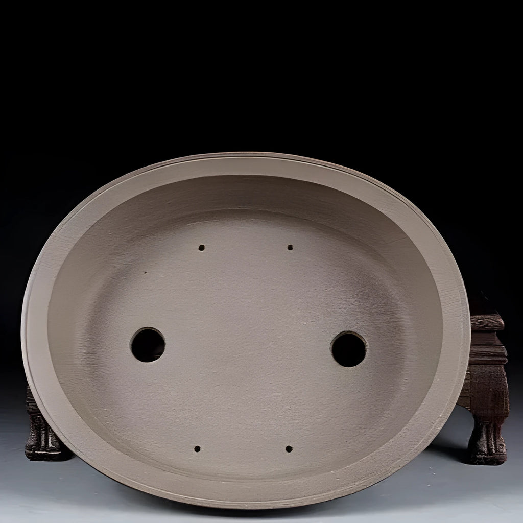 Handmade purple sand ceramic oval bonsai flower pot showing antique finish and 25cm length.