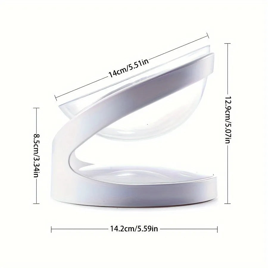 White clear plastic elevated cat food bowl with tilted anti-vomit design on a raised stand.
