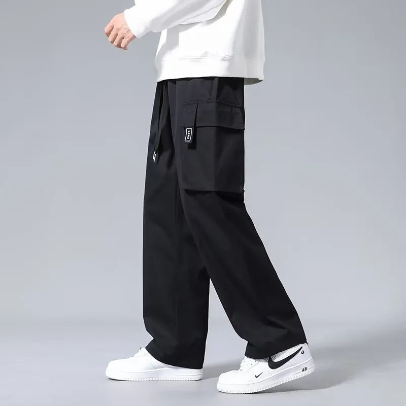 Boys' straight-leg cargo pants in army green with drawstring waist and multiple large pockets.