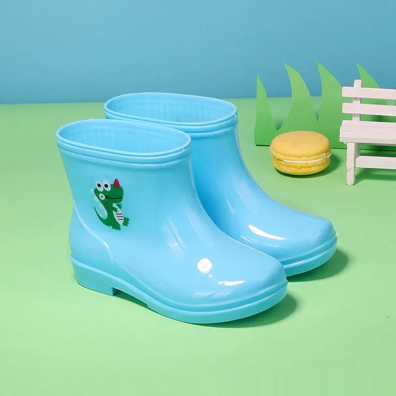 Children's non-slip rain boots in solid colour, plastic upper, mid-calf height, sizes 22-31 yards