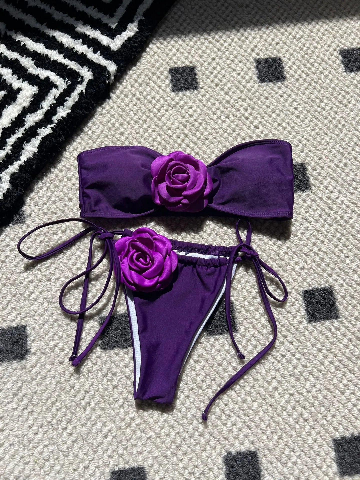 Women's solid colour drawstring tube top and bikini brief swimsuit set on a mannequin.