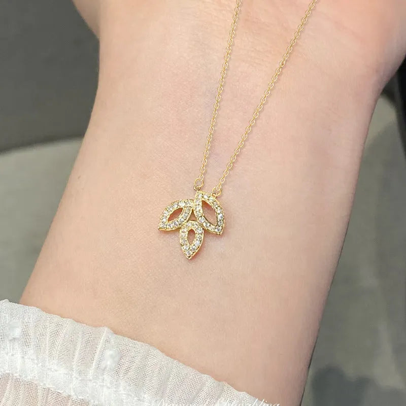 Women's yellow gold hollow leaf necklace with inlaid zircon and adjustable O-ring copper chain