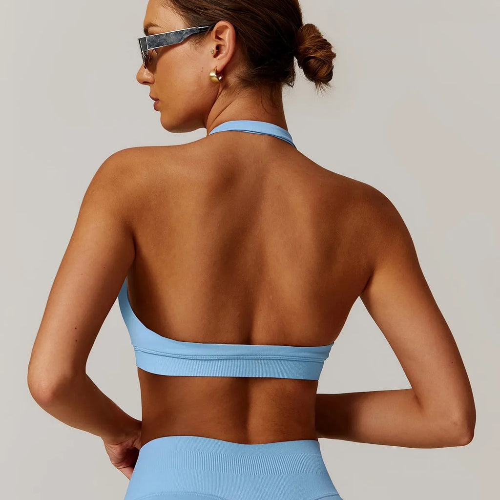 Halter neck sports bra for women in multiple colours with medium support and built-in chest pads