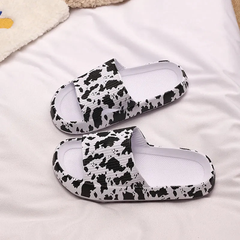Women's leopard print EVA slippers with thick sole on a white background.