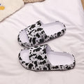 Women's leopard print EVA slippers with thick sole on a white background.