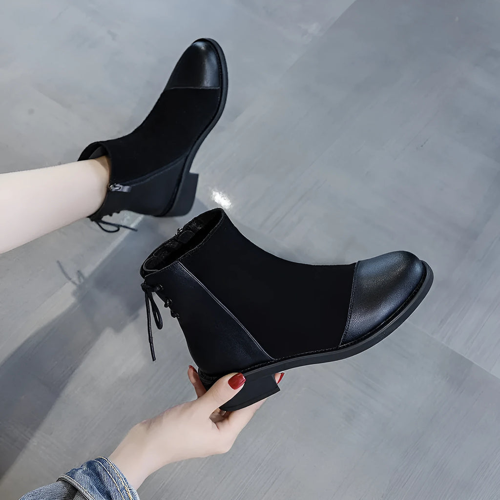 Women's black knee-high soft leather martin boots with side zipper and bow detail