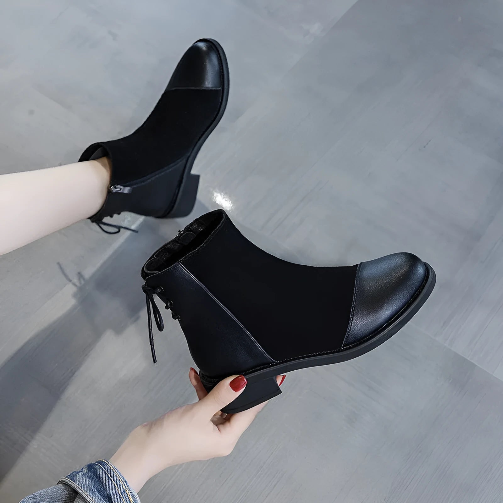 Women's black knee-high soft leather martin boots with side zipper and bow detail