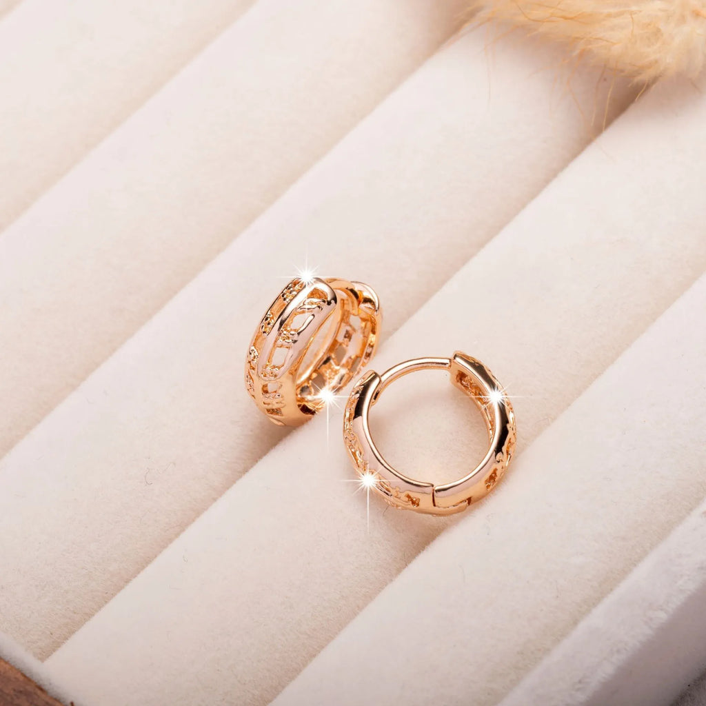 Hollowed copper earrings in heart or leaf shape with rose gold finish