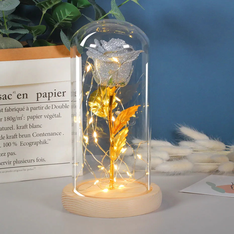 Eternal rose flower LED light in glass cover with warm white glow, six colours available, handmade