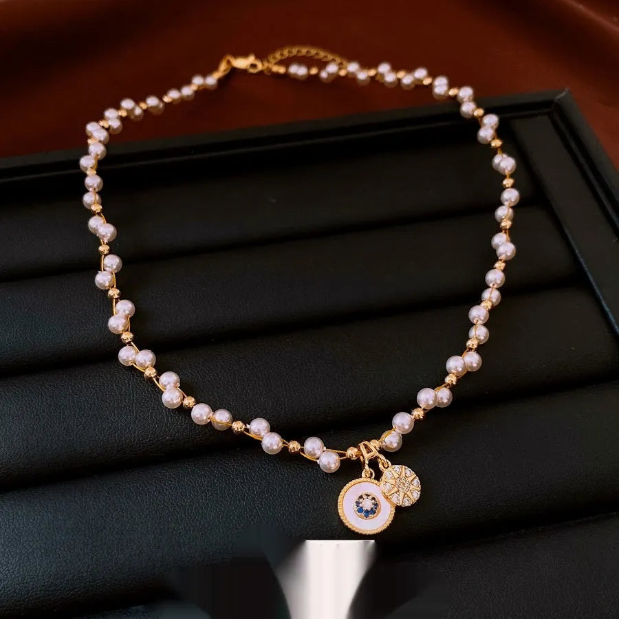 Gold electroplated pearl pendant necklace with adjustable 41-50cm clavicle chain and zircon inlaid details