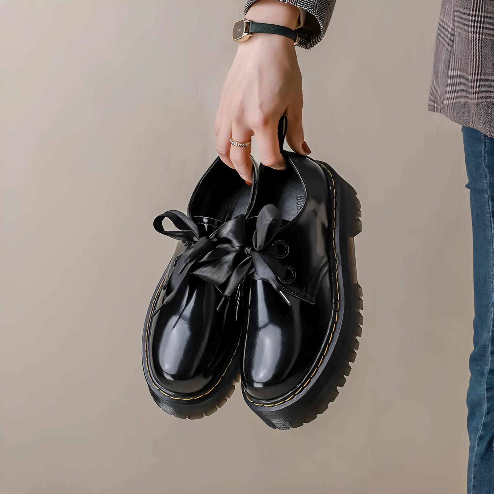 Women's black thick-soled leather shoes with cross straps and ribbon decoration