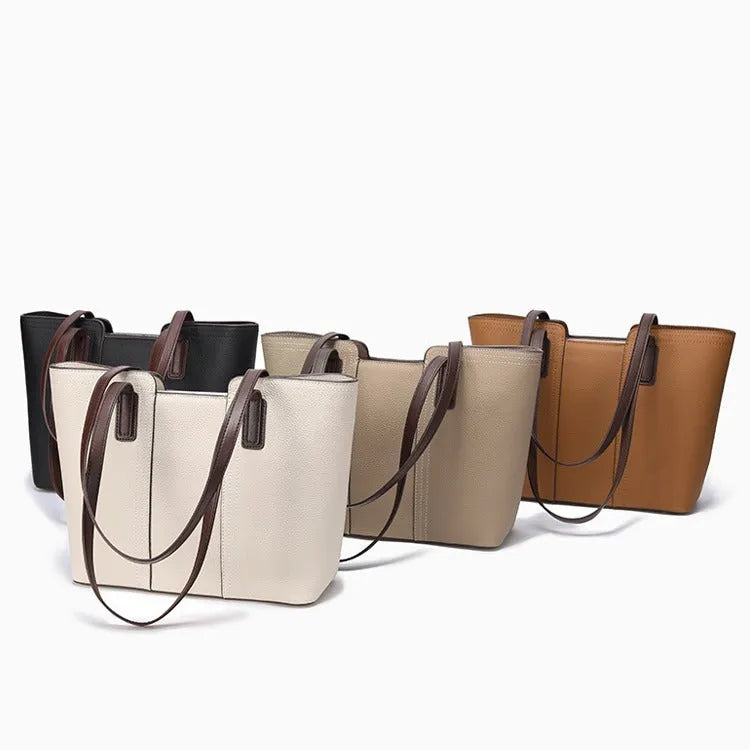 Women's genuine leather shoulder bag in khaki colour showing box-type design and organised interior compartments