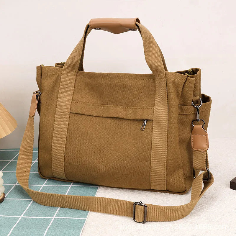 Large capacity canvas tote bag with internal organisers and side zippers in Army Green colour