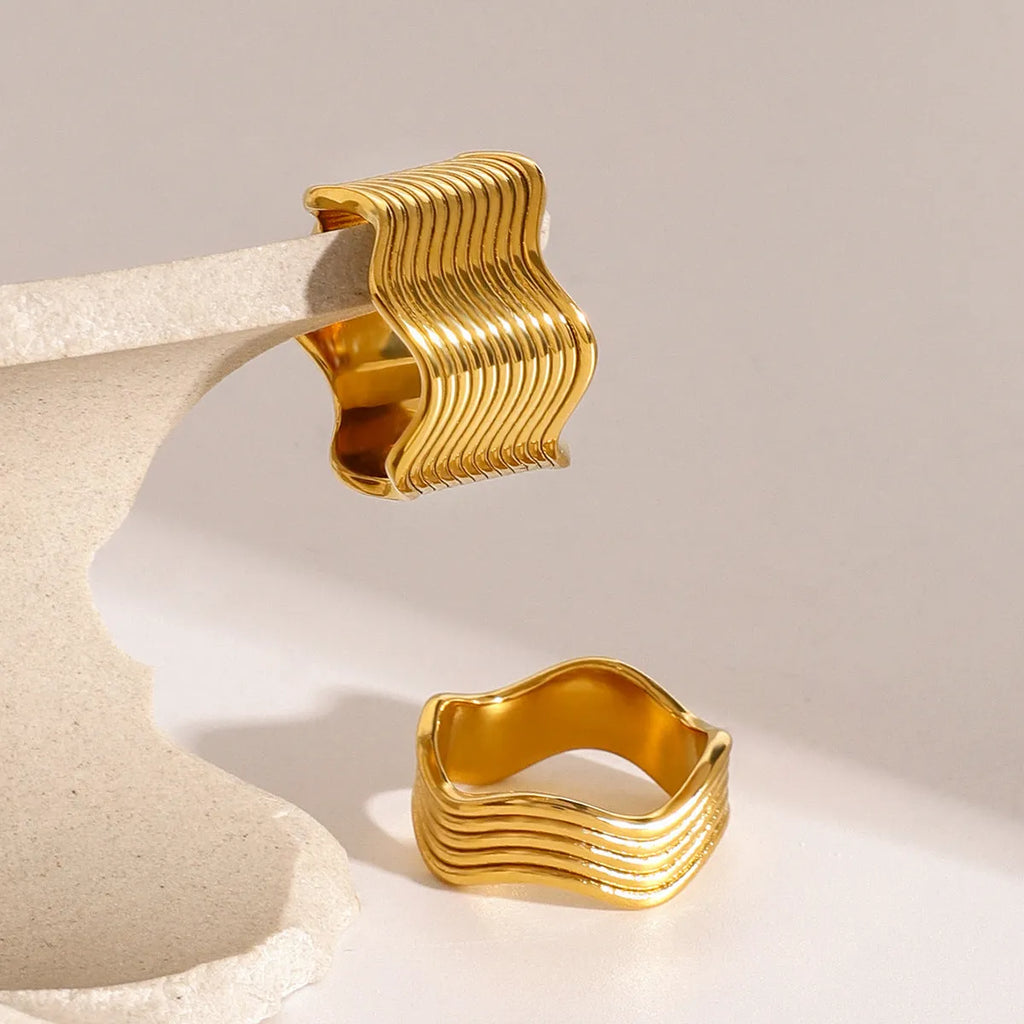 Women's stainless steel geometric wave ring with wide band surface and Korean style design