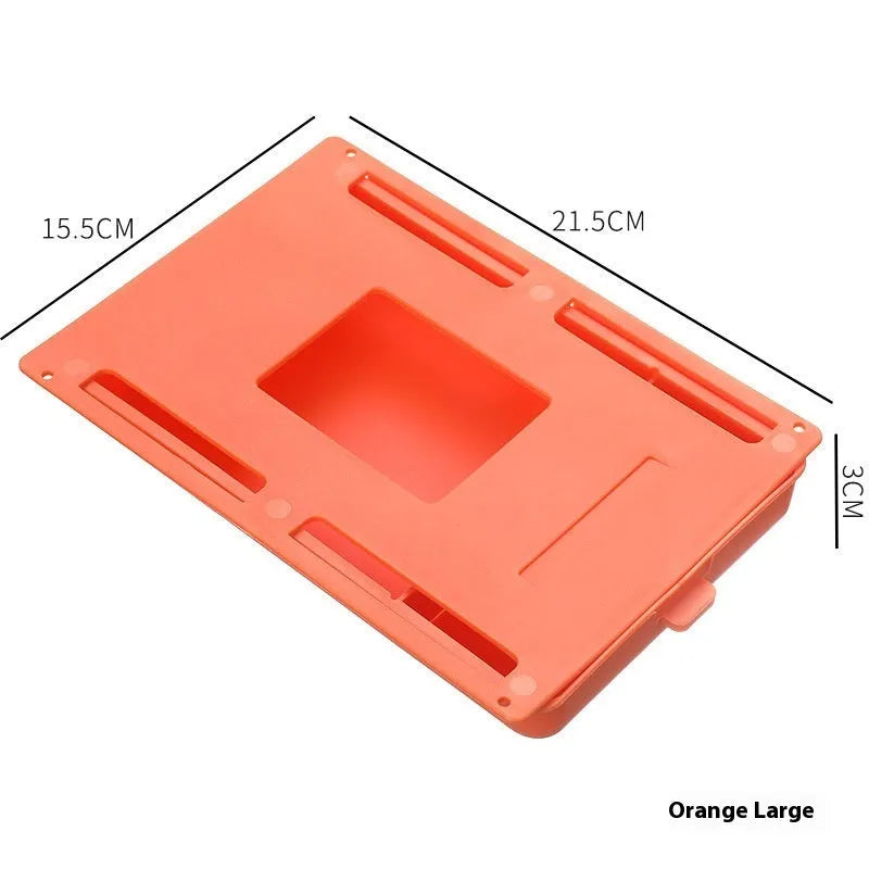 Small white plastic storage box with a grid pattern, shown adhered underneath a wooden table.